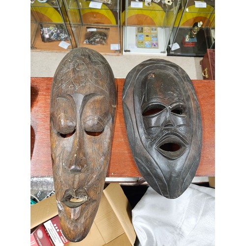 548 - 2 Wooden Mask wall Hangings