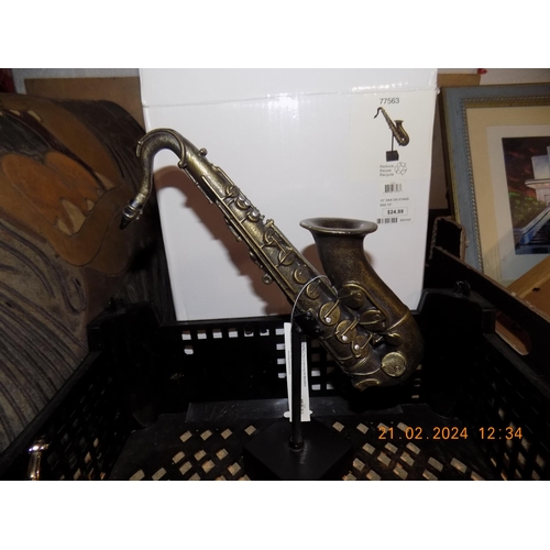 235 - Basket of Collectable Saxophone's. Inc Pin Badges etc