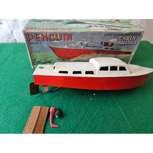 34 - Penguin Series 4 Long Range Clockwork Cabin Cruiser