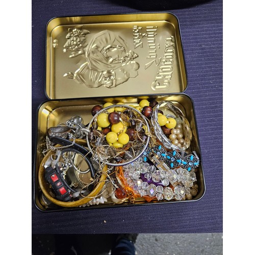 556 - Tin of Costume Jewellery