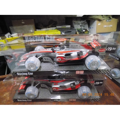 240 - 2 New Battery Operated Racing Cars