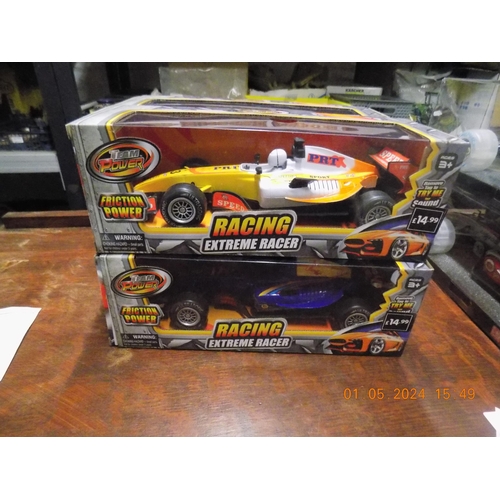 242 - 2 New Battery Operated Racing Cars