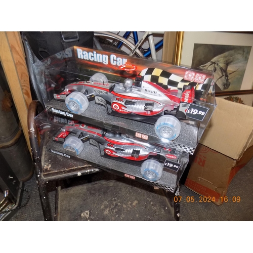 106 - 2 New Battery Operated Racing Cars