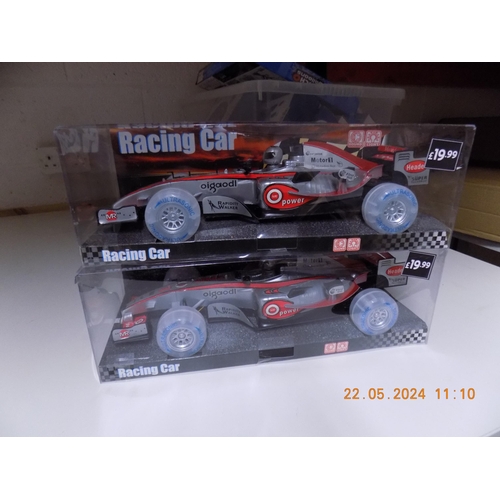 197 - 2 New Battery Operated Racing Cars