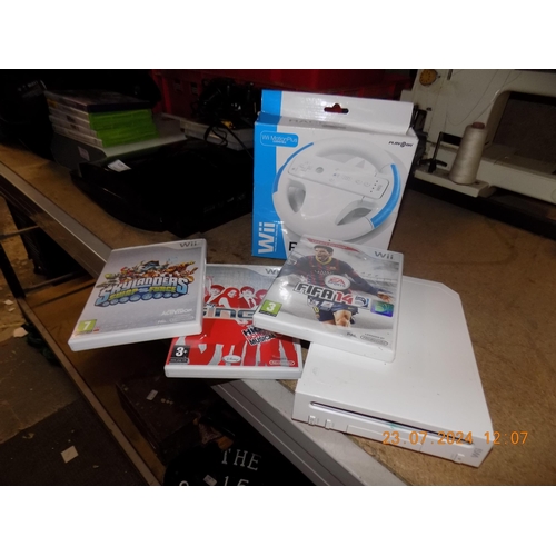 102 - Wii Console with Games and Racing Wheel