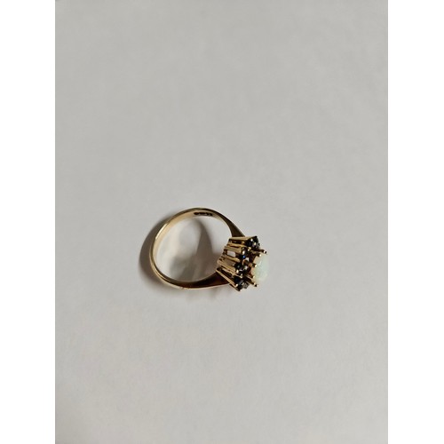 636 - 9ct Gold Sapphire and Opal Ring. Overall weight 4.53g