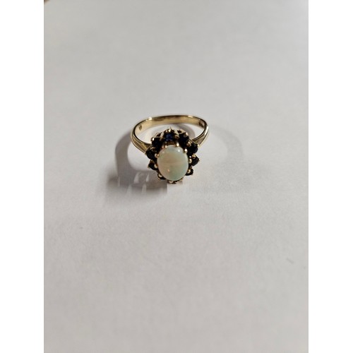 636 - 9ct Gold Sapphire and Opal Ring. Overall weight 4.53g