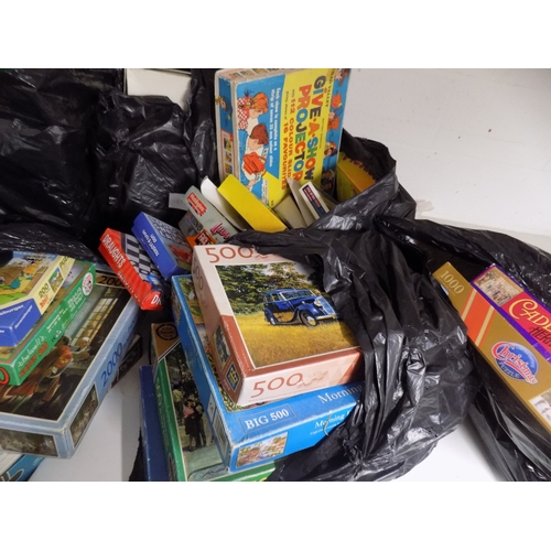 184 - 4 Bags of Jigsaw Puzzles and Games etc