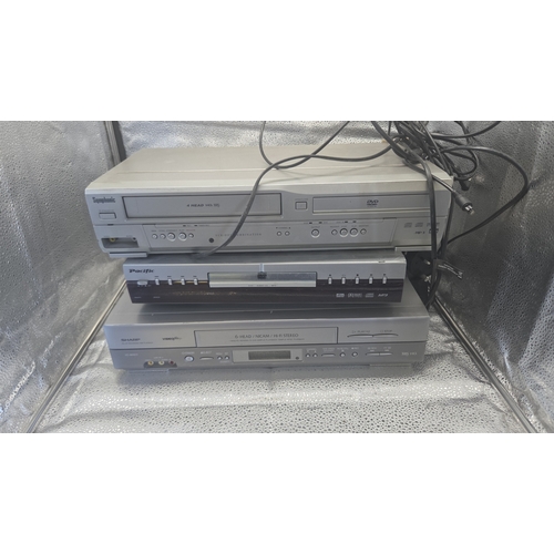 291 - A Trio of Silver-Coloured Home Media Devices Including Symphonic VCR/DVD Combo, Pacific DVD Player, ... 