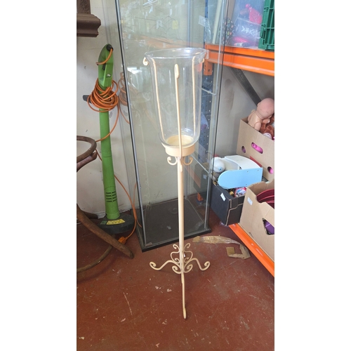 383 - A cream-painted metal floor-standing hurricane lantern