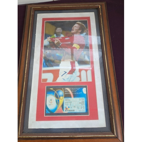 389 - A Trio of Sports Memorabilia comprising John Saunders Motorsport Prints and a 2002 FIFA World Cup Fr... 