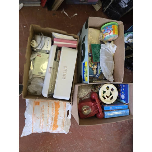 391 - An Assortment of Mixed Household Goods, Toys, and Craft Supplies Including a Vintage-Style Toy Telep... 