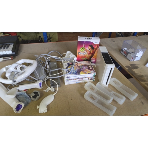251 - A Collection of Nintendo Wii Gaming Equipment and Accessories Including Console and Games working or... 