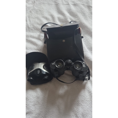 284 - TWO PAIRS OF BINOCULARS COMPRISING HANIMEX 8X40 AND COMPACT 8X21 MODELS