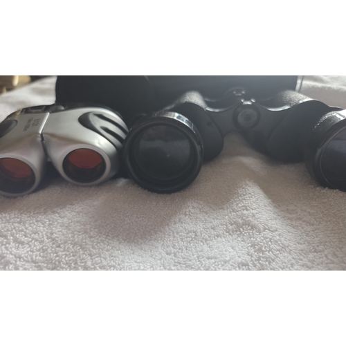 284 - TWO PAIRS OF BINOCULARS COMPRISING HANIMEX 8X40 AND COMPACT 8X21 MODELS