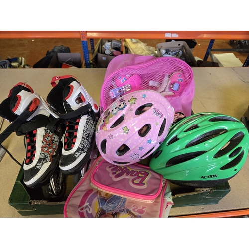 297 - A Collection of Children's Skating Gear and Accessories Including Branded Helmets and Skates