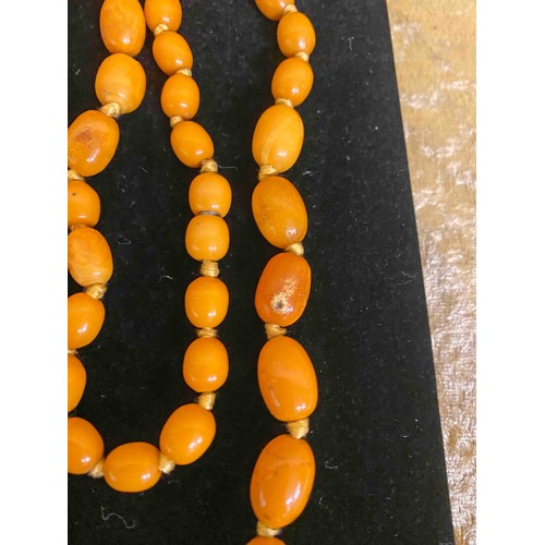 21 - 1930's Amber Beads weighing approximately 51 grams