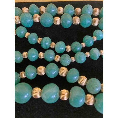 25 - Jade beads interspaced with yellow metal beads