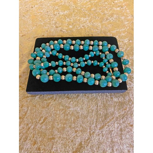 25 - Jade beads interspaced with yellow metal beads