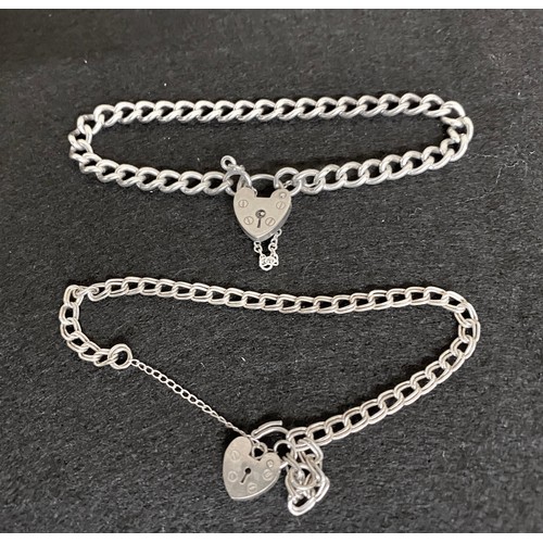 9 -  Two silver bracelets with heart clasps