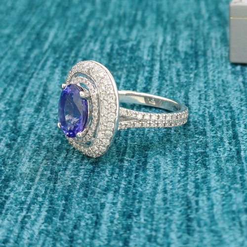 18 - 18ct White Gold Tanzanite and Diamond Ring
- Triple Halo Design
- Diamond encrusted full shank
- 7.4... 