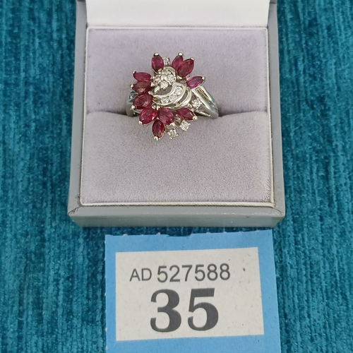 35 - Ruby & Diamond Cluster Ring
- 14ct
- 6.3g