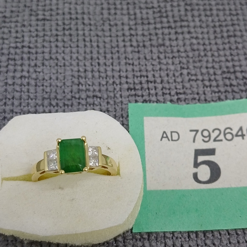 5 - Emerald and Diamond Ring
- 18ct Yellow Gold
- 0.26ct
Size: J