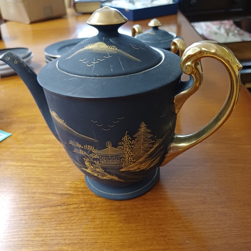 20 - Japanese Geisha Girl Tea Set.  Very fine china in a matte finish.