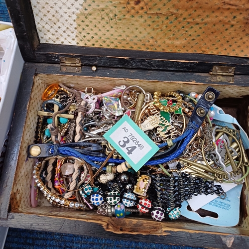 34 - Two boxes of assorted costume jewellery