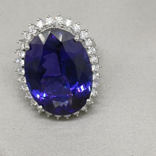 67 - A Stunning Ring.  36 ct Tanzanite Stone set in a ring of Diamonds.  The colour is so pure.
Size: O