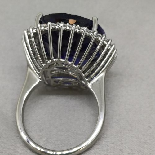 67 - A Stunning Ring.  36 ct Tanzanite Stone set in a ring of Diamonds.  The colour is so pure.
Size: O