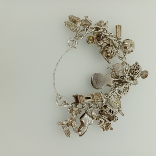 4 - This is a lovely Silver Charm Bracelet which is packed with charms and very heavy.
- weight 83 g
- c... 