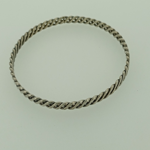 10 - A Silver Bangle with a twist/lattice pattern.
- weight 13 g