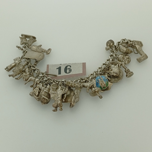 16 - Here we have the second of our Silver Charm Bracelets.  This is a very heavy bracelet crammed with c... 