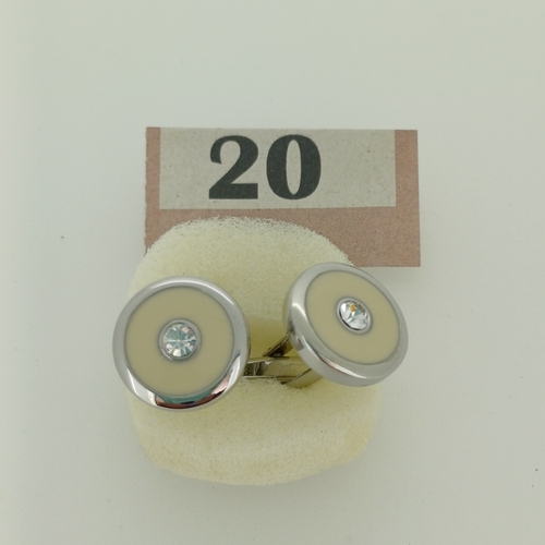 20 - Cuff links . Silver Metal with a White/cream insert with a diamond effect stone