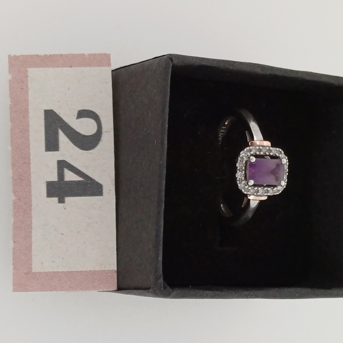 24 - Ladies Gold Ring with Purple Stone and White Stone surround.
- 9 ct Gold
- weight 2.6 g