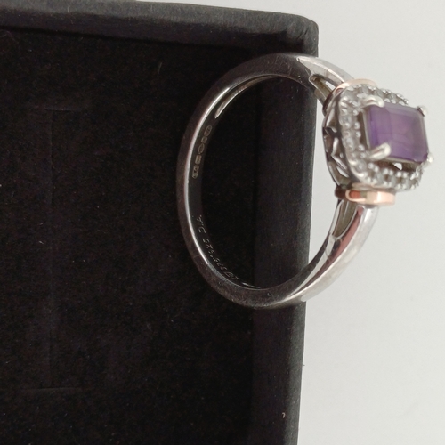 24 - Ladies Gold Ring with Purple Stone and White Stone surround.
- 9 ct Gold
- weight 2.6 g