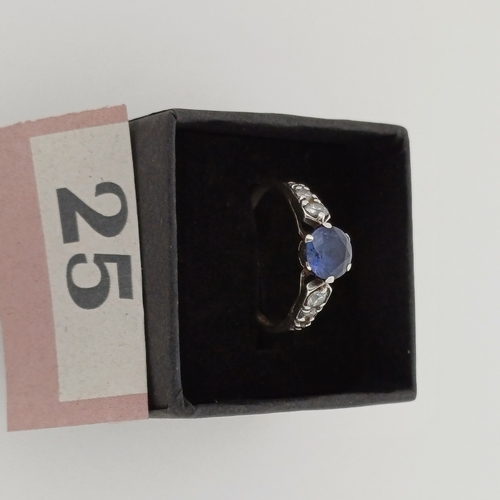 25 - Ladies Gold Ring with Blue Stone (possibly Sapphire) with White Stones
- 9 ct Gold
- weight 2 g