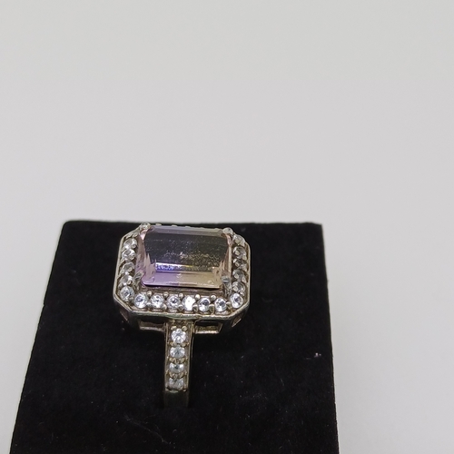 58 - Ladies Silver Ring with Purple and White Stones
Size O