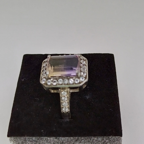 58 - Ladies Silver Ring with Purple and White Stones
Size O