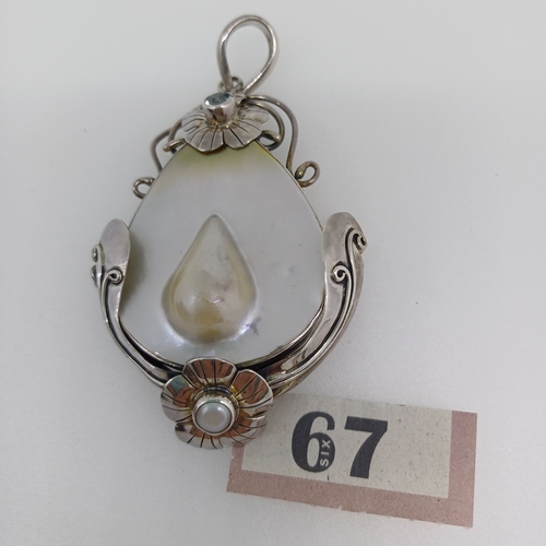 67 - This is a truly stunning Mother of earl Pendant set in Silver with Pearl Inset at the Bottom and a B... 