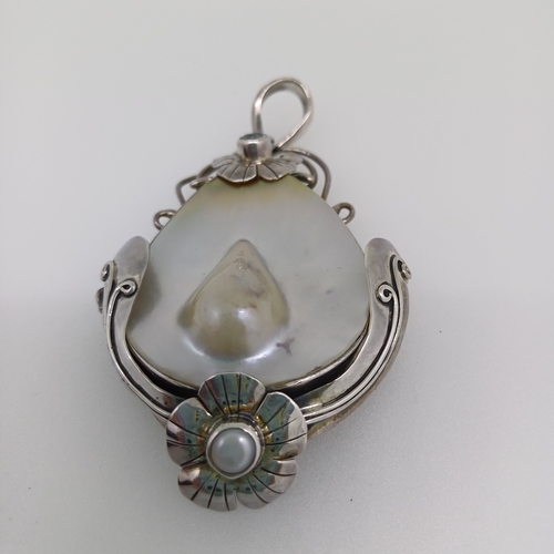 67 - This is a truly stunning Mother of earl Pendant set in Silver with Pearl Inset at the Bottom and a B... 