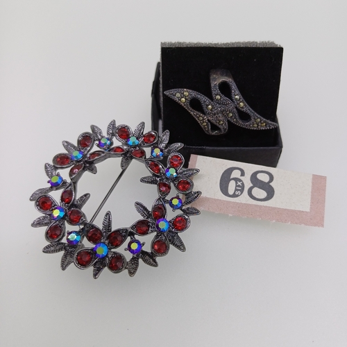 68 - Here we have a very pretty brooch with multi colour and red stones and an unusual ring both are grea... 