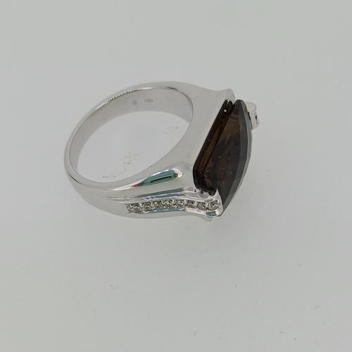 90 - A quality Topaz Ring with Diamond Sides
- 18ct white gold
- weight 13 g
Size - T