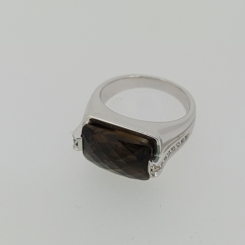 90 - A quality Topaz Ring with Diamond Sides
- 18ct white gold
- weight 13 g
Size - T