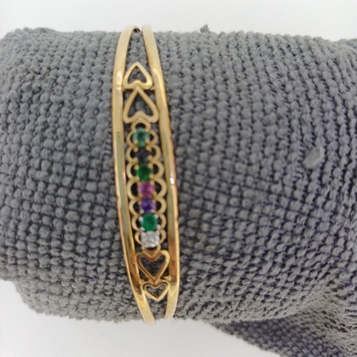 130 - A Very Pretty 9 ct Gold Bangle with multi colour stones  It weighs 5 g