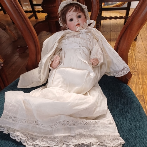 200 - Vintage Doll with Porcelain Face, Arms and Legs.  This is fully dress with bonnet.  The Vendor advis... 