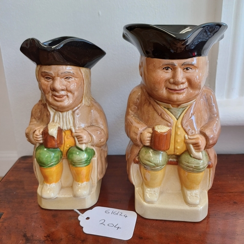 204 - A Pair of Toby Jugs 18cm and 16cm