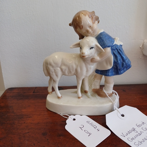 209 - This is a Figure of a Girl with a Sheep.  The Markings are crossed swords 1859 (German)