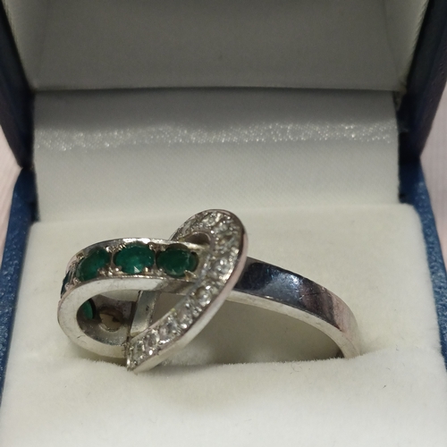 248 - Stunning Ladies Emerald and Diamond Ring in unusual design.
- 18ct White Gold